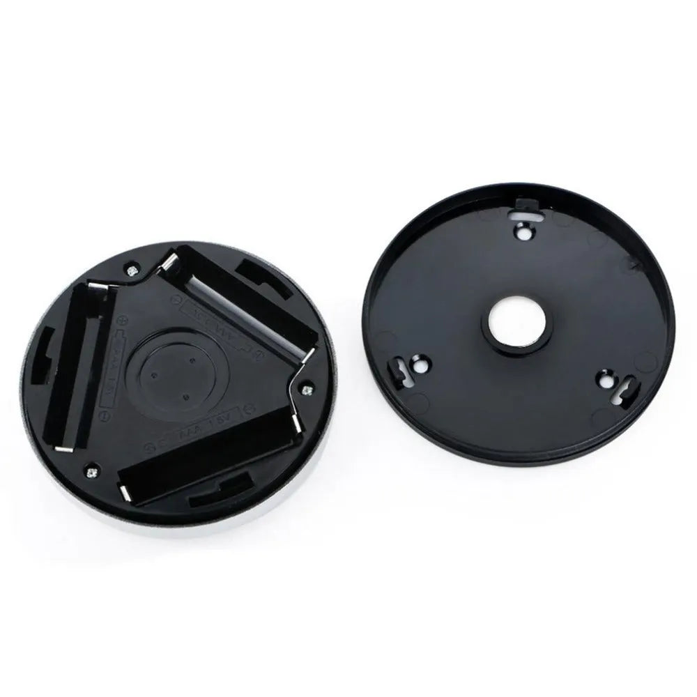 Silver circular battery-powered motion sensor night light with a white PC plastic lampshade.