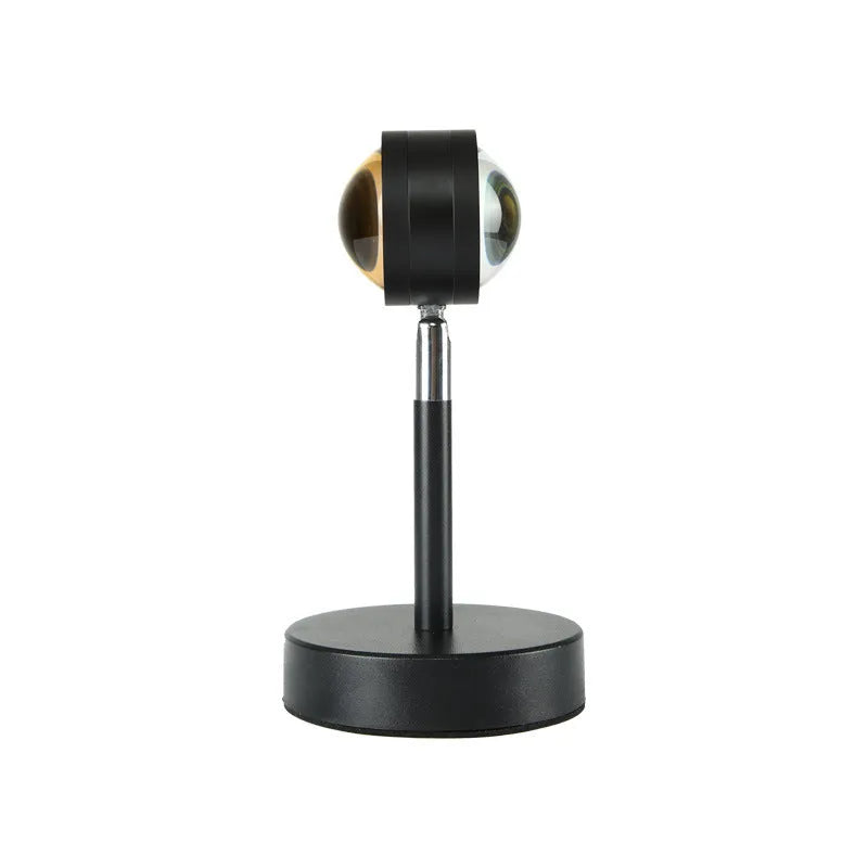 Black USB dual-head sunset rainbow projection table lamp with touch control on bedside table