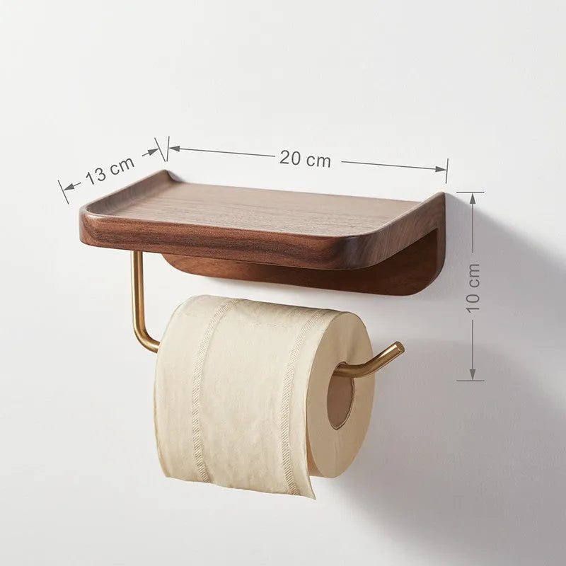 Solid walnut wood wall-mounted paper towel holder with brass fittings.