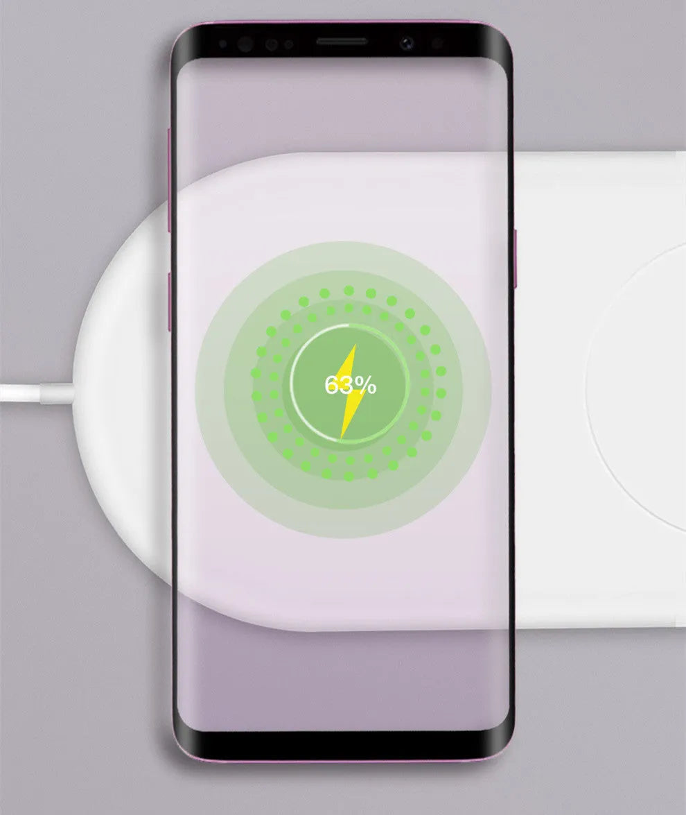 White dual wireless charger for two mobile phones on a table.
