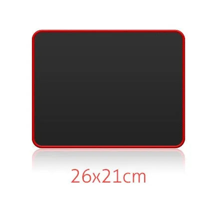 Large black and red seaming mouse pad on a desk with a computer mouse on it