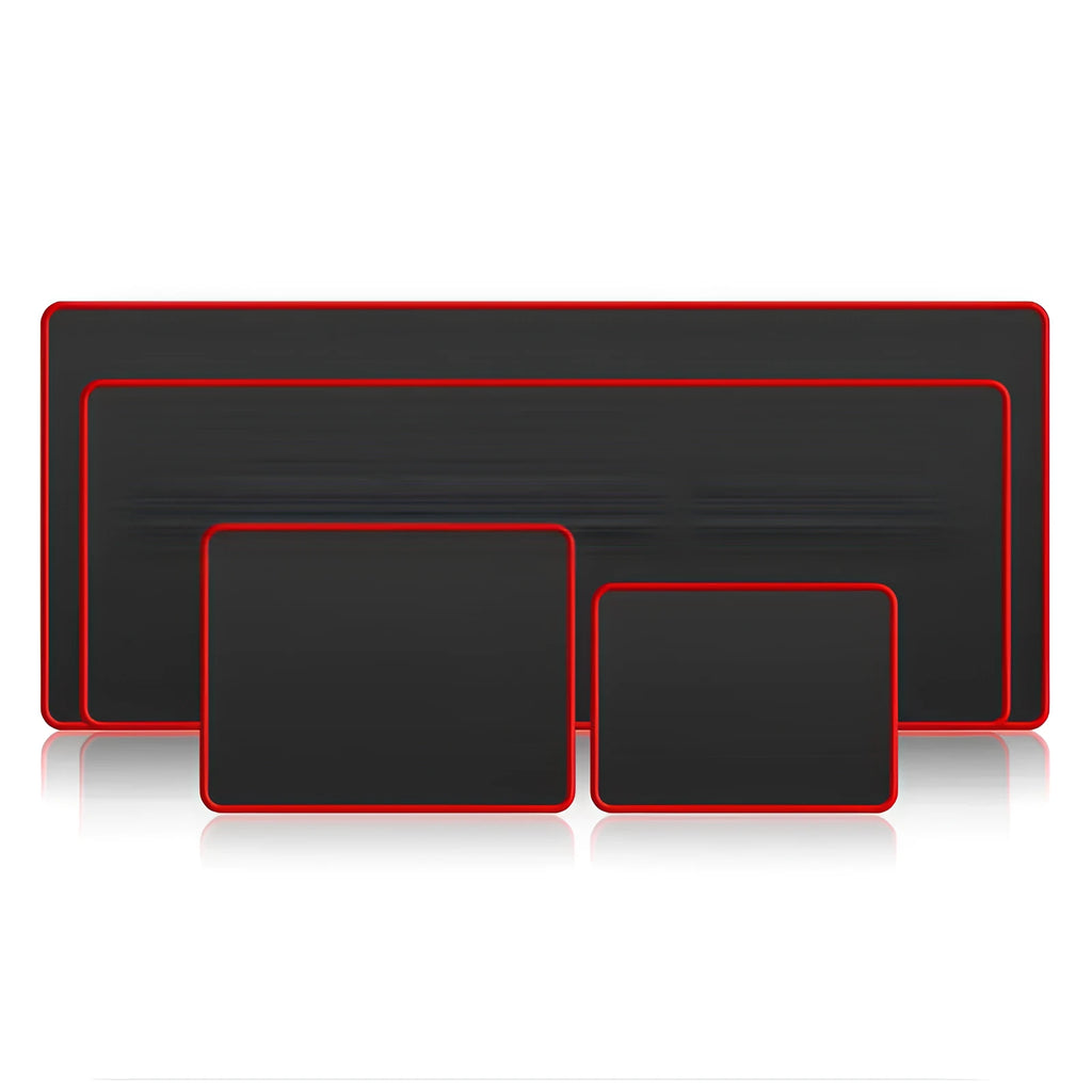 Large black and red seaming mouse pad on a desk with a computer mouse on it