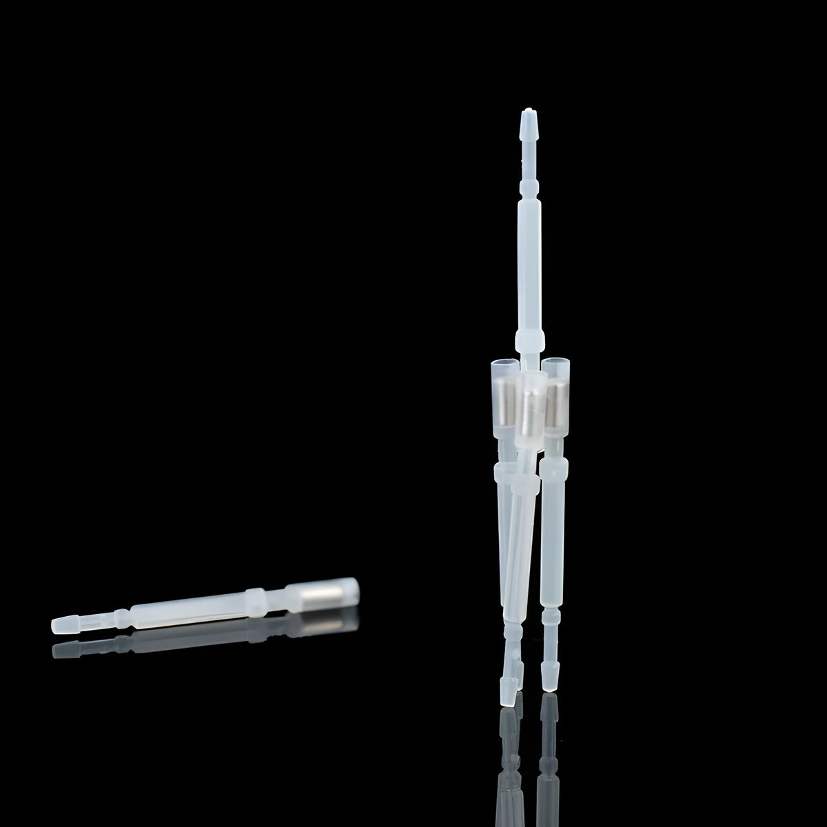White 3D printer automatic leveling probe with metal touch sensor pin on dark background