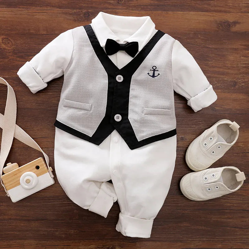 Baby boy wearing a long-sleeved gentleman-style cotton romper in a neutral colour.