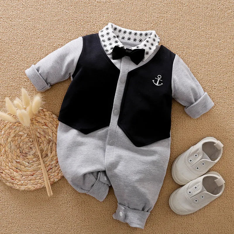 Baby boy wearing a long-sleeved gentleman-style cotton romper in a neutral colour.