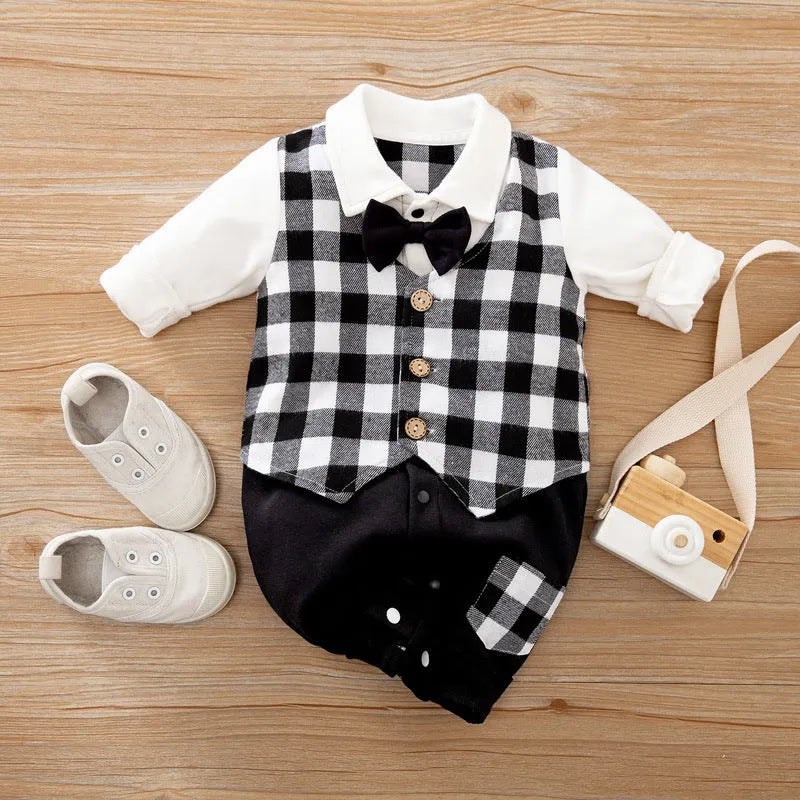 Baby boy wearing a long-sleeved gentleman-style cotton romper in a neutral colour.