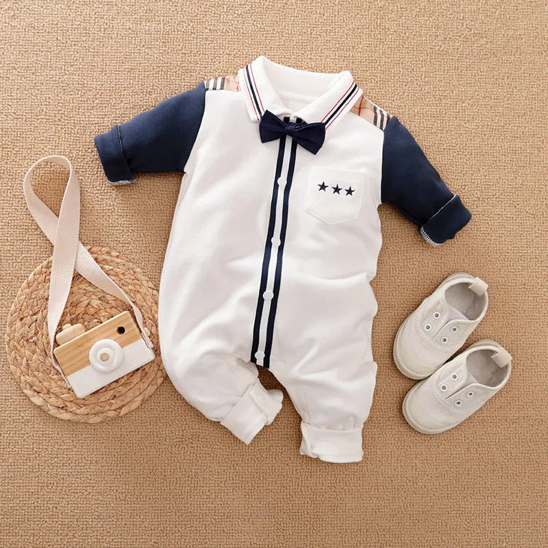 Baby boy wearing a long-sleeved gentleman-style cotton romper in a neutral colour.