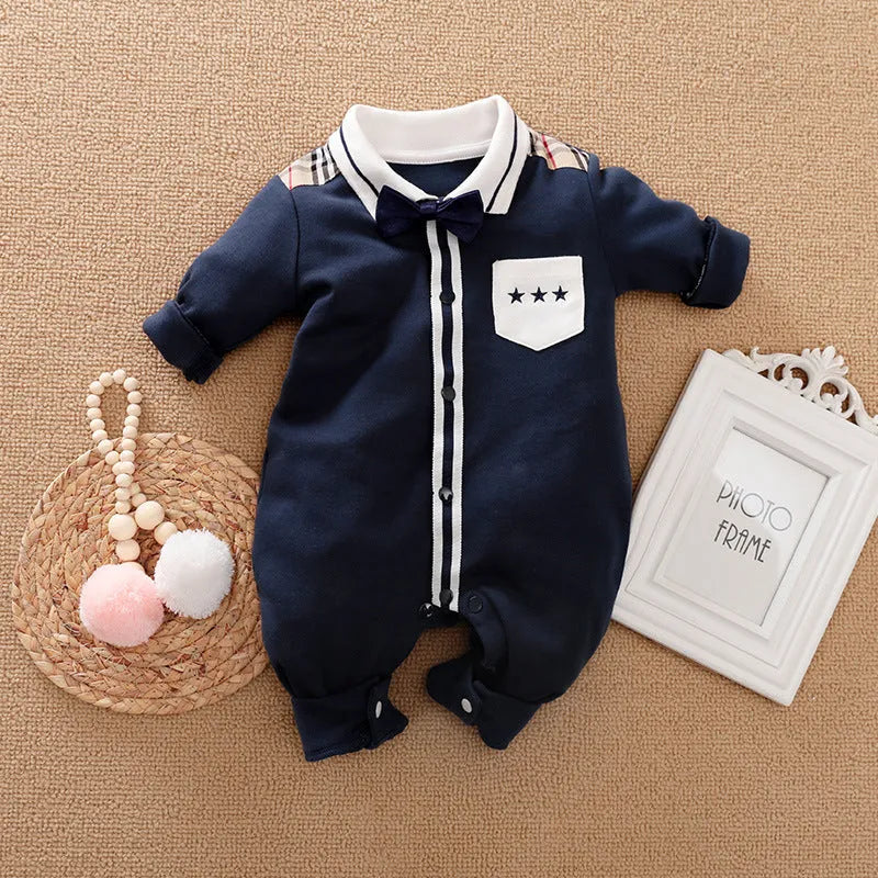 Baby boy wearing a long-sleeved gentleman-style cotton romper in a neutral colour.