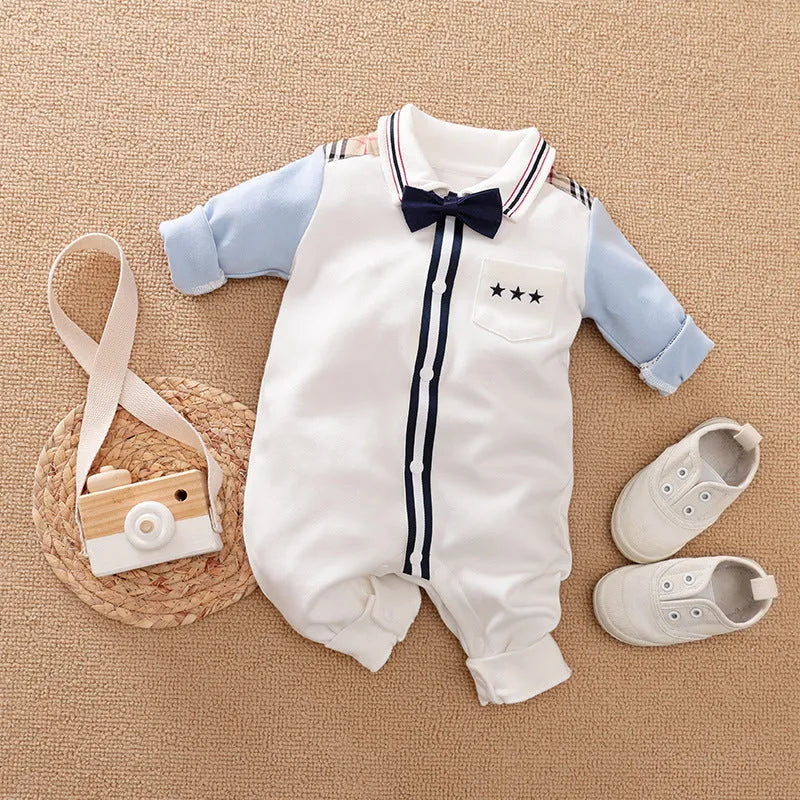 Baby boy wearing a long-sleeved gentleman-style cotton romper in a neutral colour.