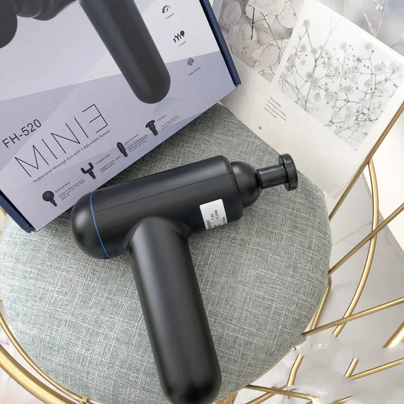 Black handheld fascia gun muscle massager with USB charging port