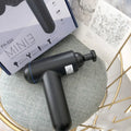 Black handheld fascia gun muscle massager with USB charging port