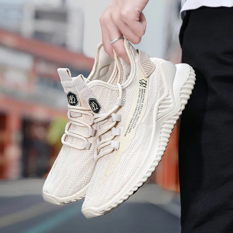 Men's white mesh sports shoes with rubber sole showing front-tie design and round toe shape