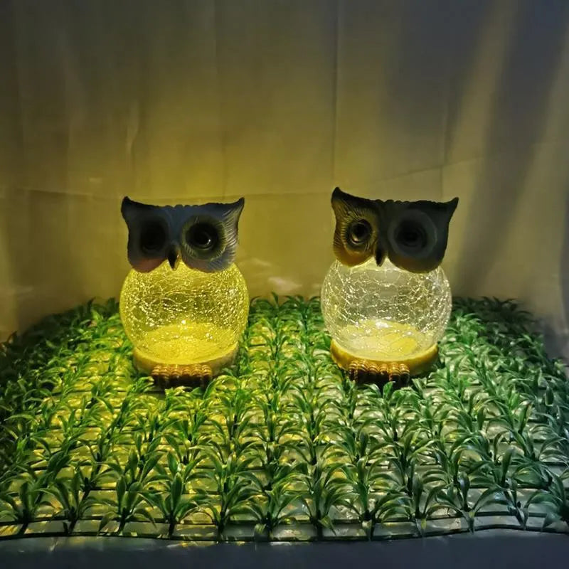 White solar owl garden light with realistic detailing and LED illumination for outdoor placement
