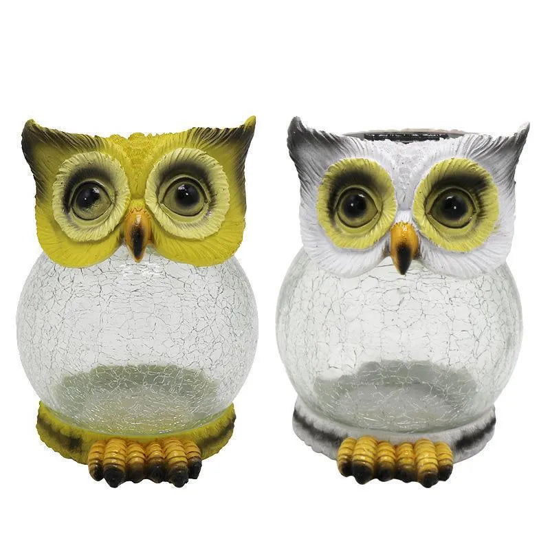 White solar owl garden light with realistic detailing and LED illumination for outdoor placement
