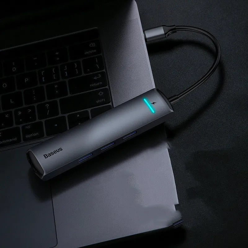 Dark grey Type-C docking station with mechanical eye design compatible with Apple MacBook and iPhone