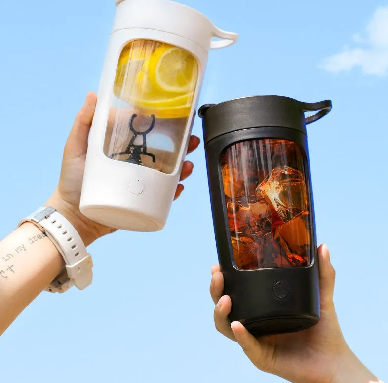 Portable USB-rechargeable blender cup in black, blue, pink or white, showing 650ml capacity markings.