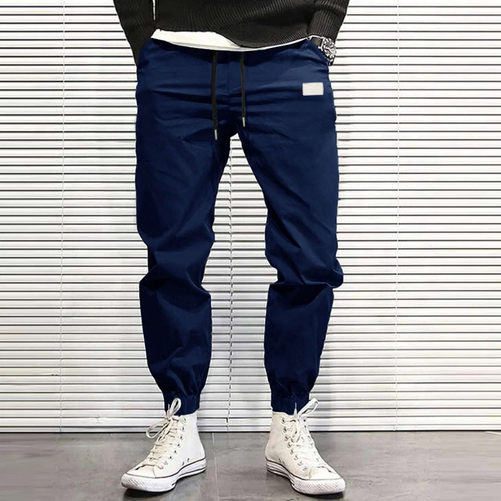 Men's quick-dry loose tapered running trousers in army green, side view on model
