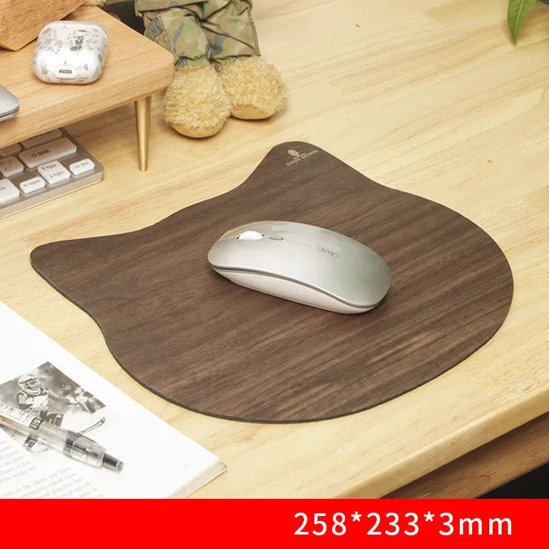 Extra large wooden mouse pad with walnut surface and natural rubber base on a home office desk