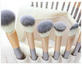 Persian make-up brush suit with rice white bristles and champagne handles arranged neatly
