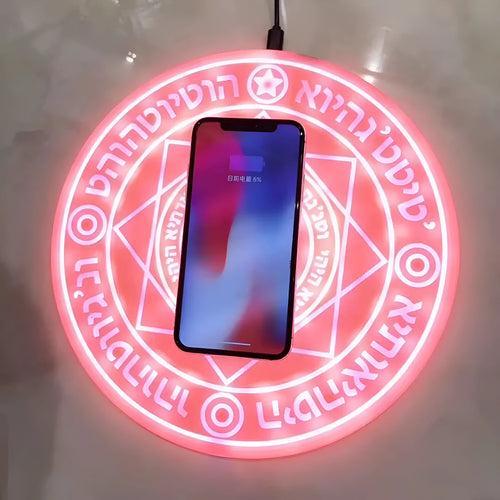 Square 25cm 10W fast wireless phone charger with glowing magic array pattern in black on a desk