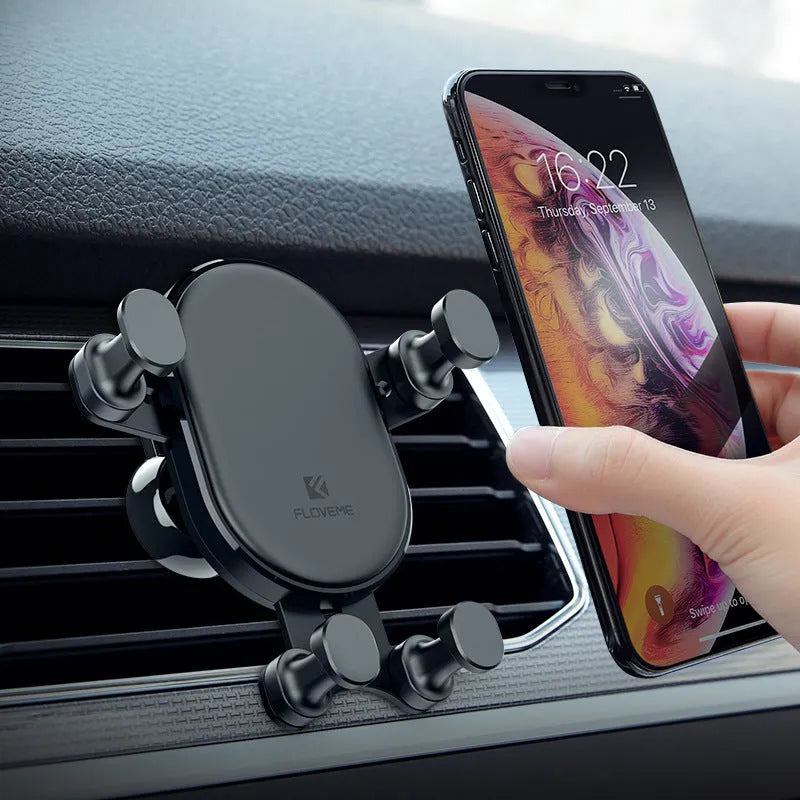 Black car phone holder with gravity bracket and 360 rotation on car dashboard