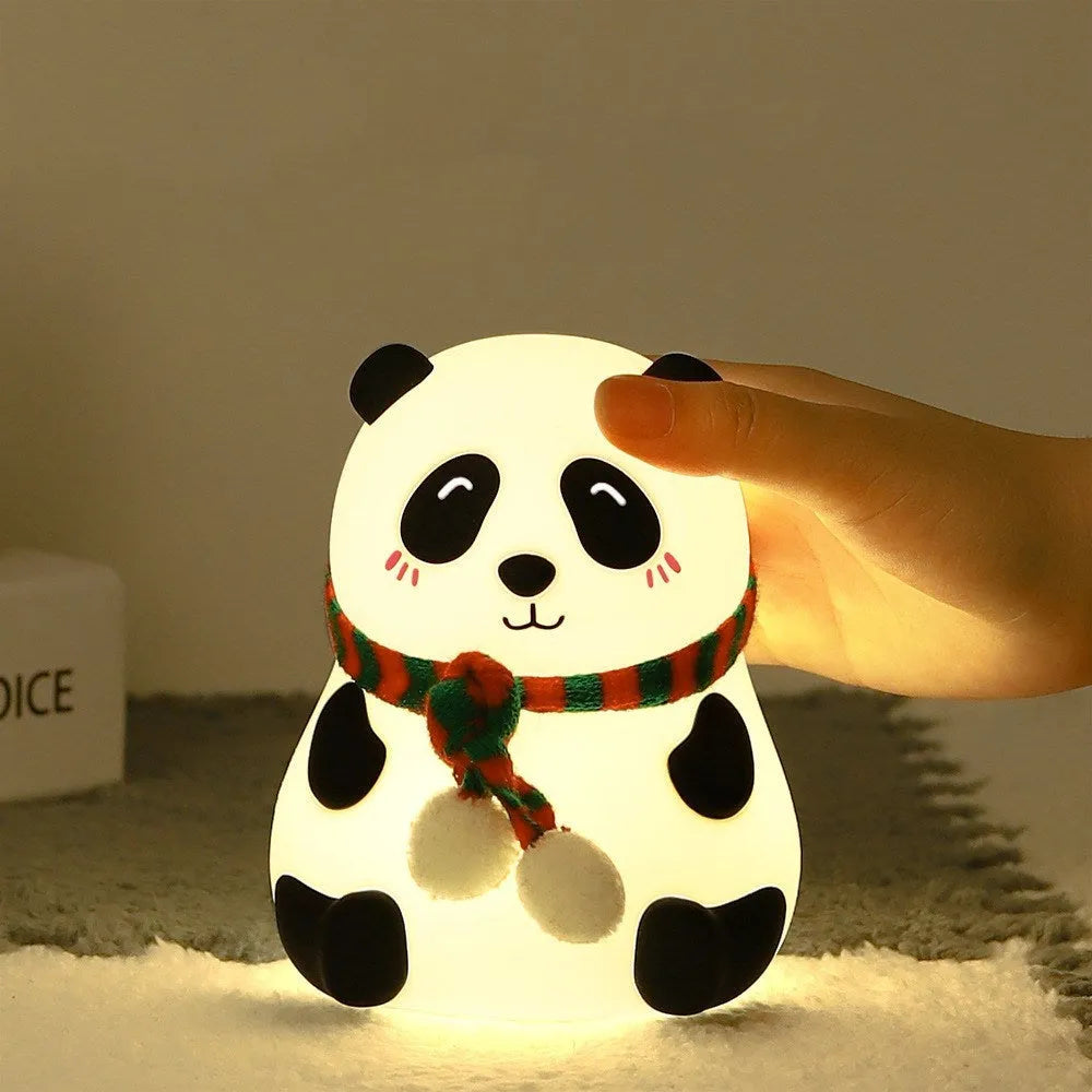 Panda-shaped silicone night light with USB cable on a table