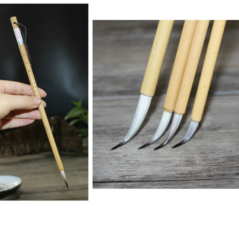 Set of four gold-handled writing brushes with mixed hair bristles for calligraphy.