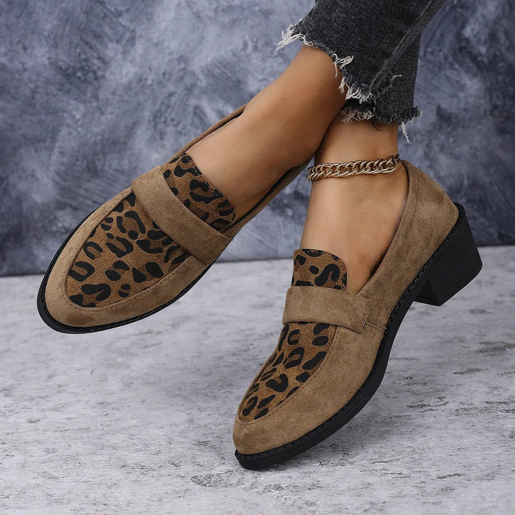 Leopard print suede slip-on pumps with a chunky heel and pointed toe in pink, brown, and khaki.