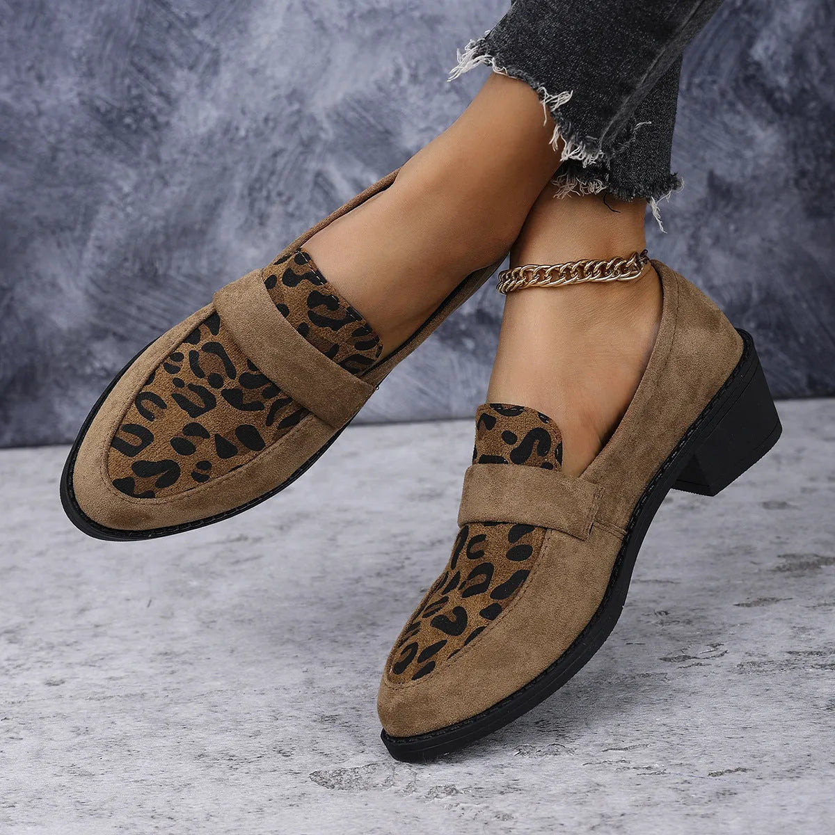 Leopard print suede slip-on pumps with a chunky heel and pointed toe in pink, brown, and khaki.