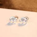 Geometric shaped silver earrings with gem setting, shown in gold and silvery finishes.
