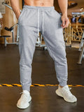 Men's grey linen-style leisure trousers with elastic drawstring waist and loose fit