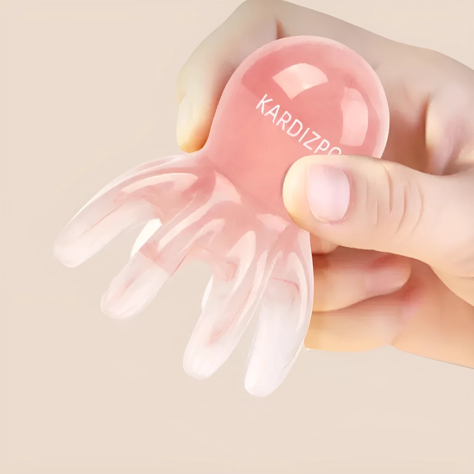Pink natural resin octopus-shaped facial massage comb for periocular meridian therapy with storage bag.