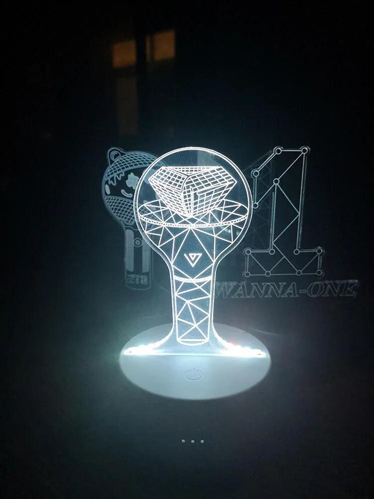 Clear acrylic display stand supporting 101 Tower Gem BTS lamp with universal voltage compatibility