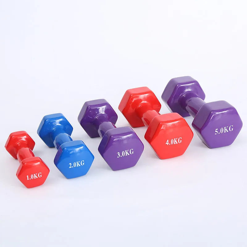 Bright plastic coated fitness dumbbells in various weights for home gym yoga and aerobics