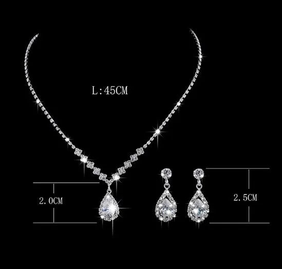 Silver alloy water-drop zircon pendant necklace and matching earrings set with rhinestone claw chain, front view