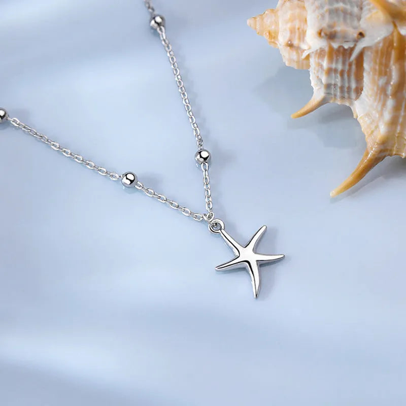 S925 sterling silver anklet with a starfish charm on a round beaded chain.