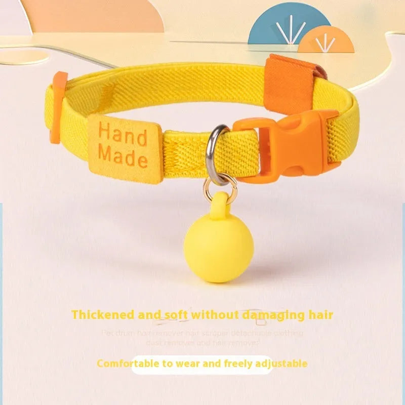 A high elasticity polyester dog collar for small dogs, shown in one of seven colours: yellow, pink, sky blue, purple, brown, dark blue or dark green.