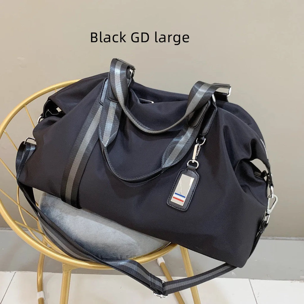 Black Gold Oxford cloth travel bag with zipper closure and three shoulder strap points on plain background
