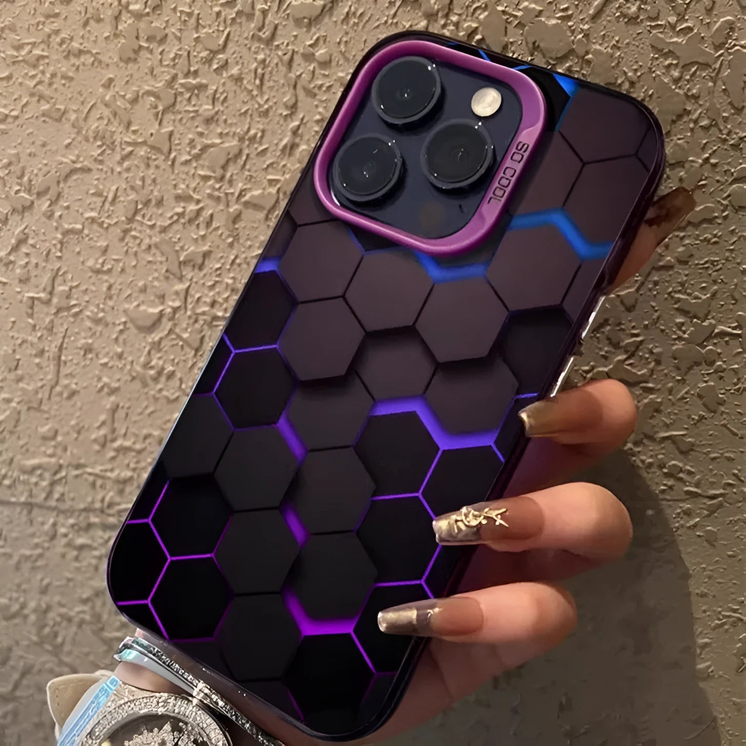 Frosted black iPhone case with honeycomb square pattern on the back.
