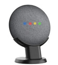 Black plastic Google Home Mini stand holder on a wooden desk
