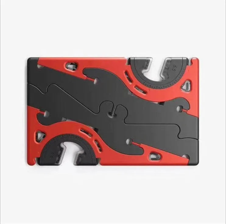 Black plastic card type mobile phone holder on desktop surface