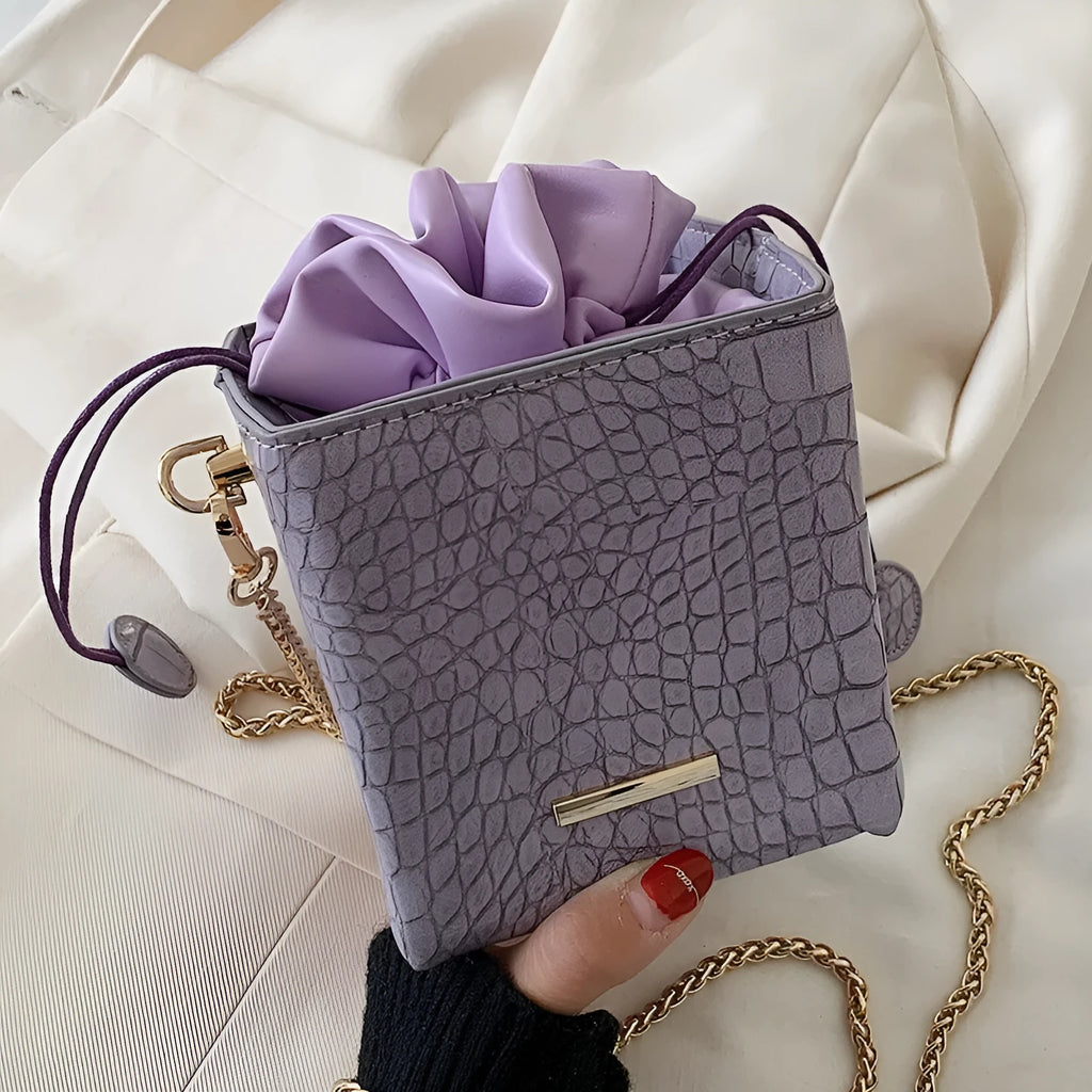 Small women's one shoulder messenger bag with chain detail in bucket shape