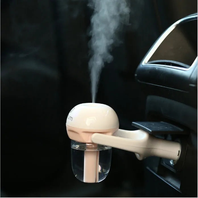Blue portable car humidifier with essential oil diffuser function on car dashboard