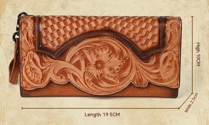 Women's embossed floral tri-fold leather wallet in retro brown colour showing cowhide texture and organisational compartments.