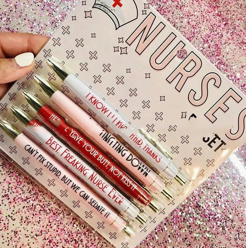 Five blue retractable ballpoint pens with white nurse-themed text, laid side by side.