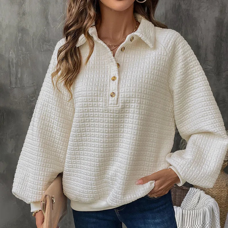 Beige women's textured knit sweater with a polo collar and long sleeves.