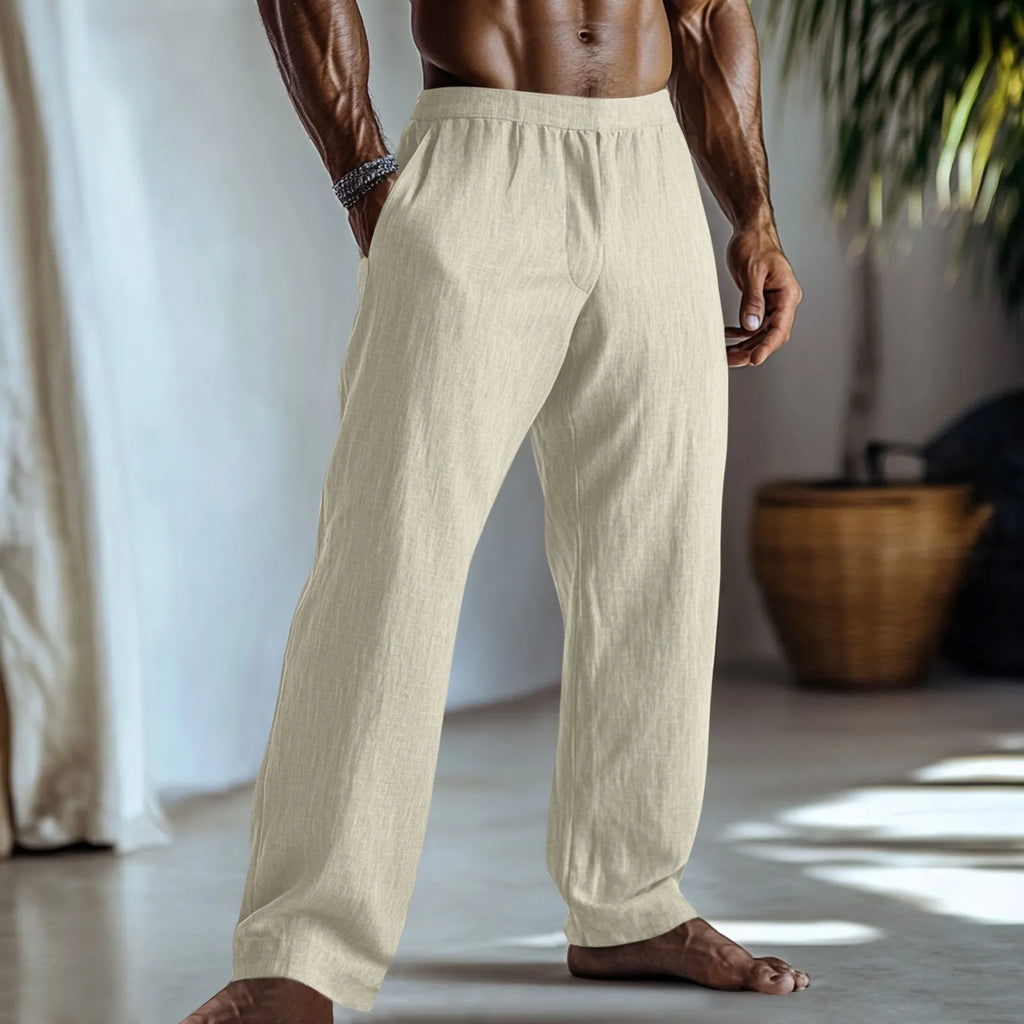 Man wearing straight-leg cotton linen casual trousers in a solid colour with pockets.