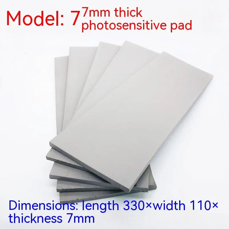Black and grey plastic photosensitive mat for seal making, shown with dimensions 330mm by 110mm.