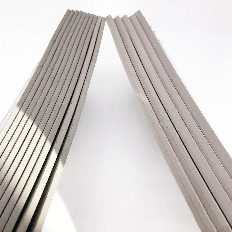 Black and grey plastic photosensitive mat for seal making, shown with dimensions 330mm by 110mm.