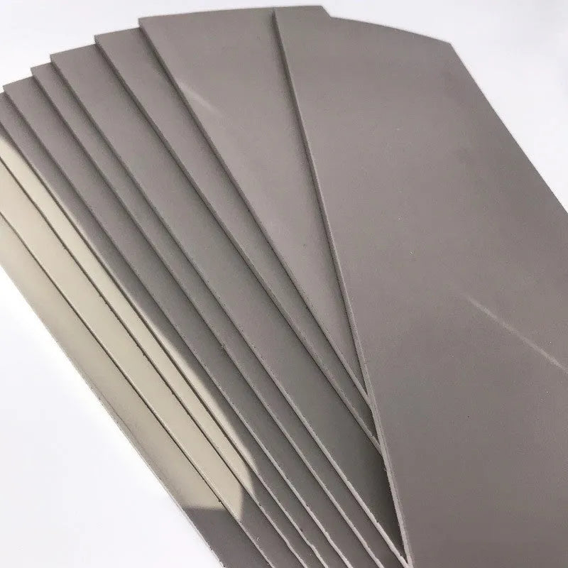 Black and grey plastic photosensitive mat for seal making, shown with dimensions 330mm by 110mm.